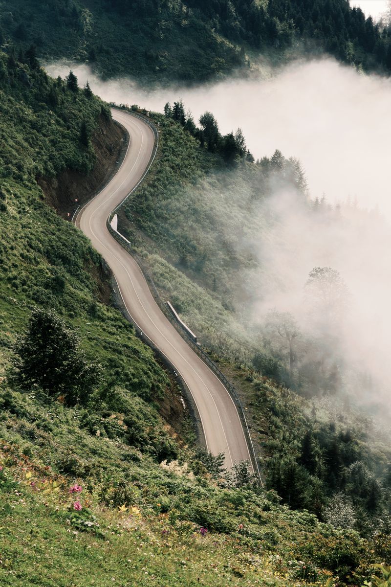 A winding mountain road at sunrise